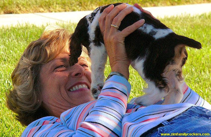 Jim's sister plays with a Cocker puppy